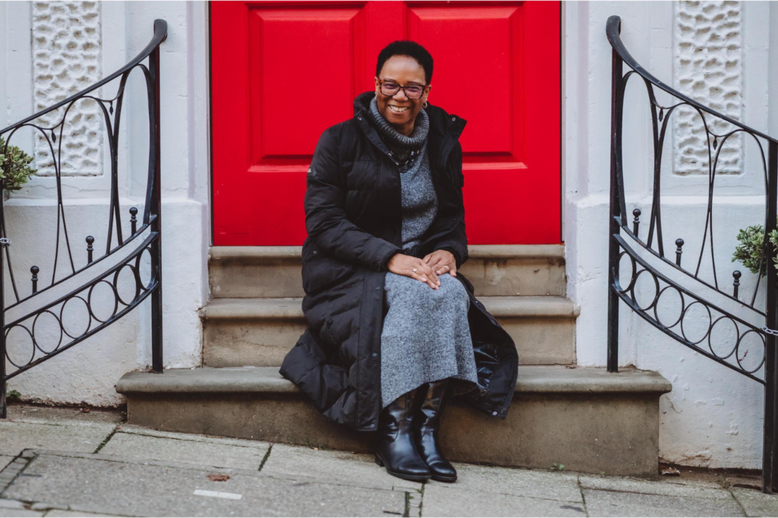 A business coach in a calm setting, representing supportive coaching focused on wellbeing and clarity