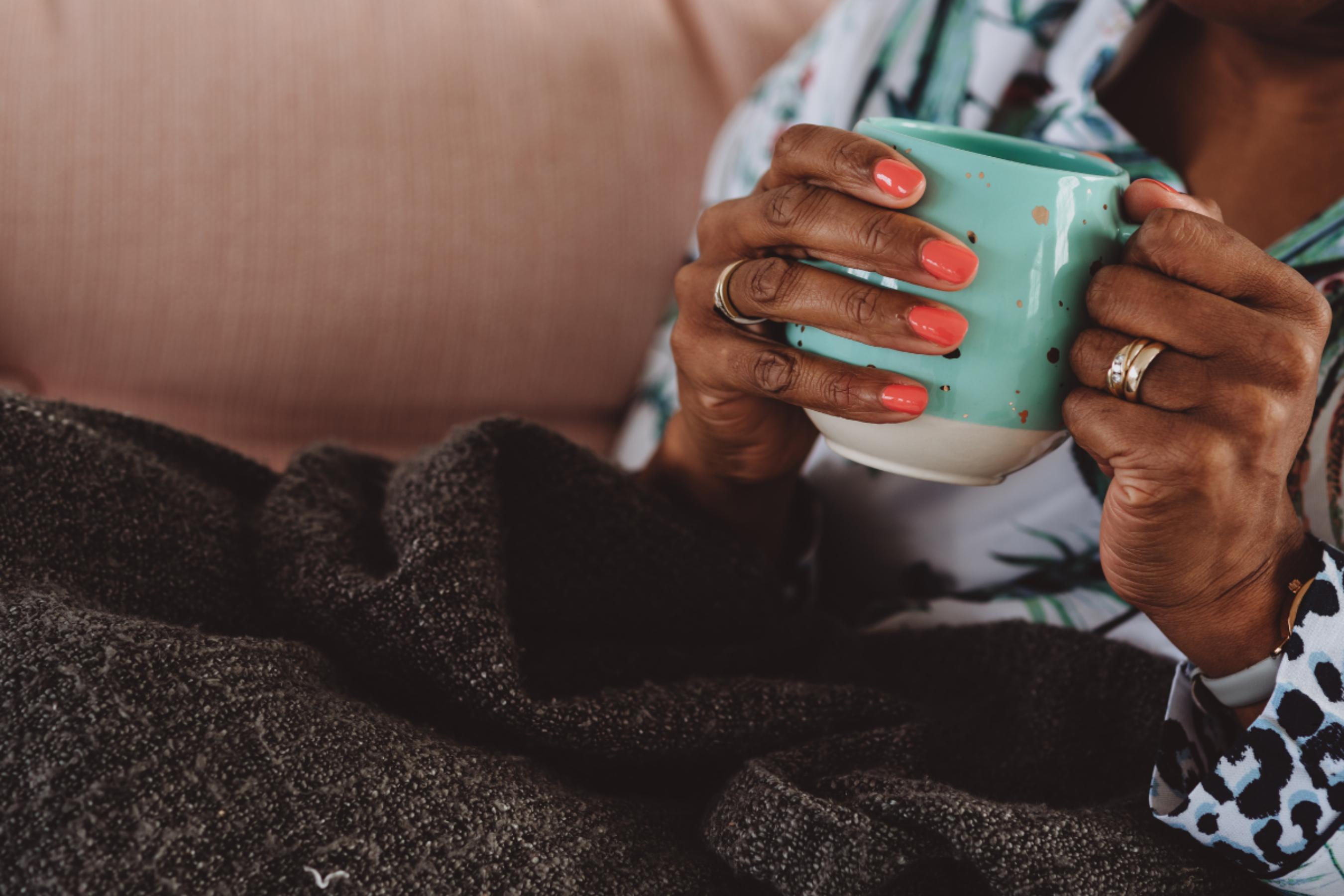 A person taking a quiet moment to rest, representing recovery and burnout prevention