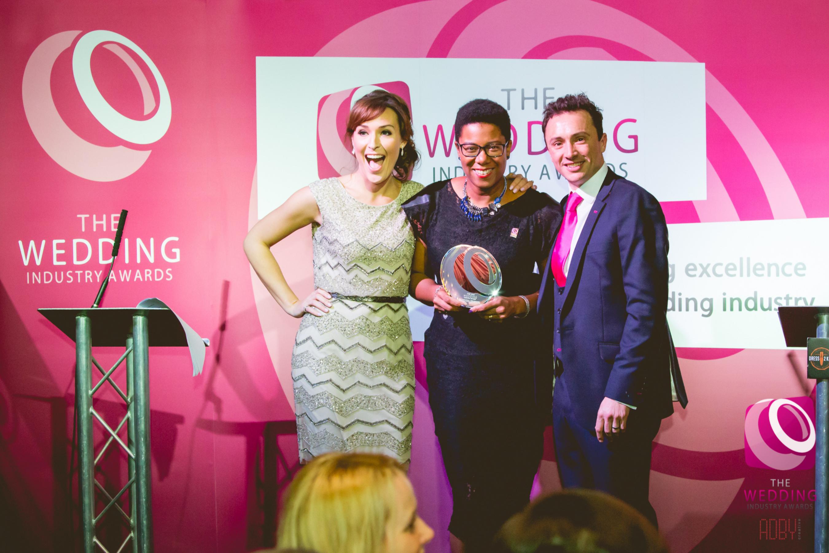 Val receiving an award for her business