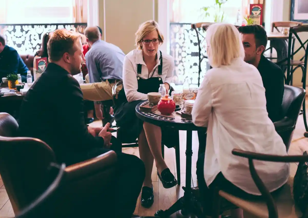 Val Mattinson collaborating with fellow professionals during an in-person business meeting